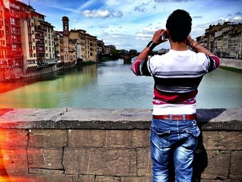 People standing in front of river