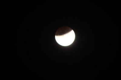 Low angle view of moon against clear sky at night