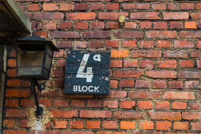 Close-up of text on brick wall