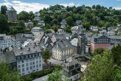 High angle view of townscape and trees in town