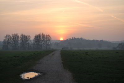 Scenic view of landscape against sky during sunset