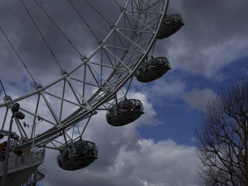 Low angle view of ferris wheel against sky