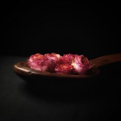 Close-up of fruits against black background