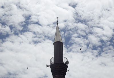 Low angle view of bell tower against sky