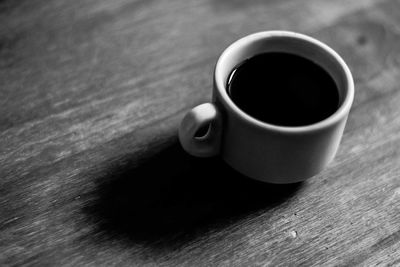 High angle view of coffee cup on table