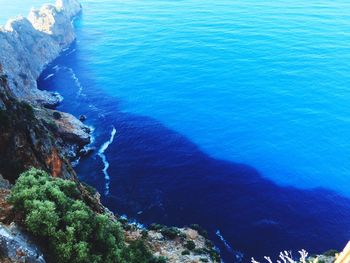 High angle view of rocks by sea