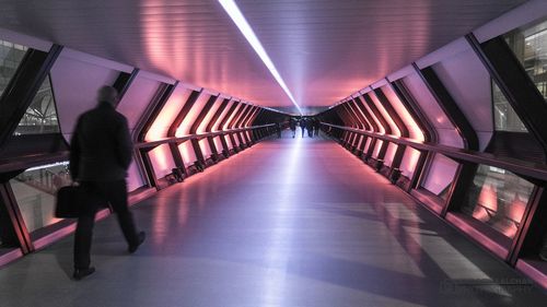 Man in illuminated corridor