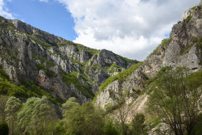 Low angle view of rocks against sky