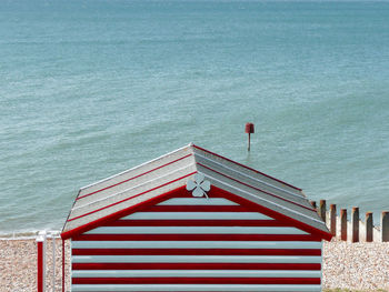 High angle view of beach hut by sea