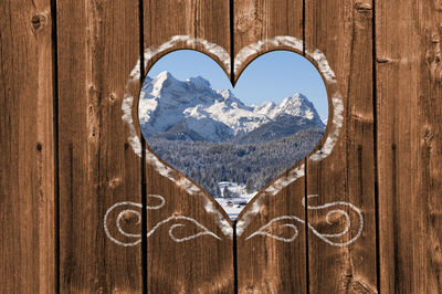 Close-up of heart shape on snow covered mountain