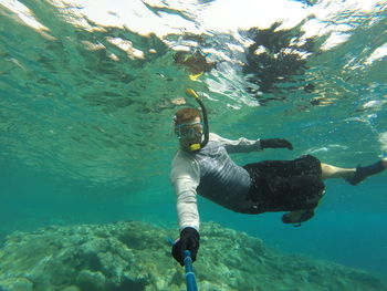 Man swimming in sea