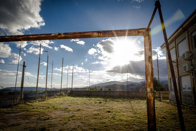 Scenic view of field against bright sun