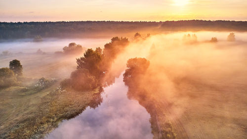 Scenic view of landscape against sky during sunset