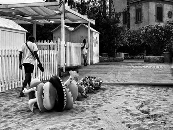 Man sitting by building