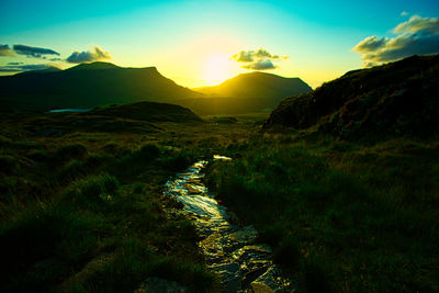Scenic view of landscape against sky during sunset