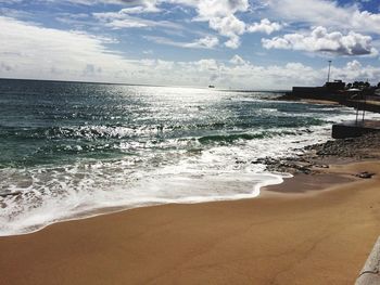 Scenic view of beach against sky