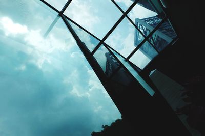 Low angle view of building against cloudy sky