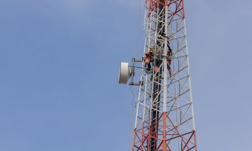 Low angle view of crane against clear sky