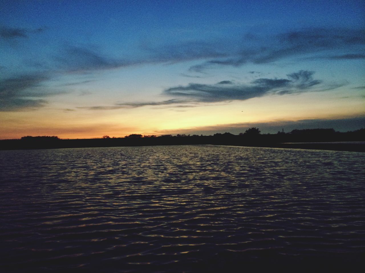 sunset, water, scenics, sky, tranquil scene, tranquility, beauty in nature, waterfront, silhouette, cloud - sky, reflection, nature, idyllic, rippled, cloud, orange color, sea, lake, dusk, outdoors