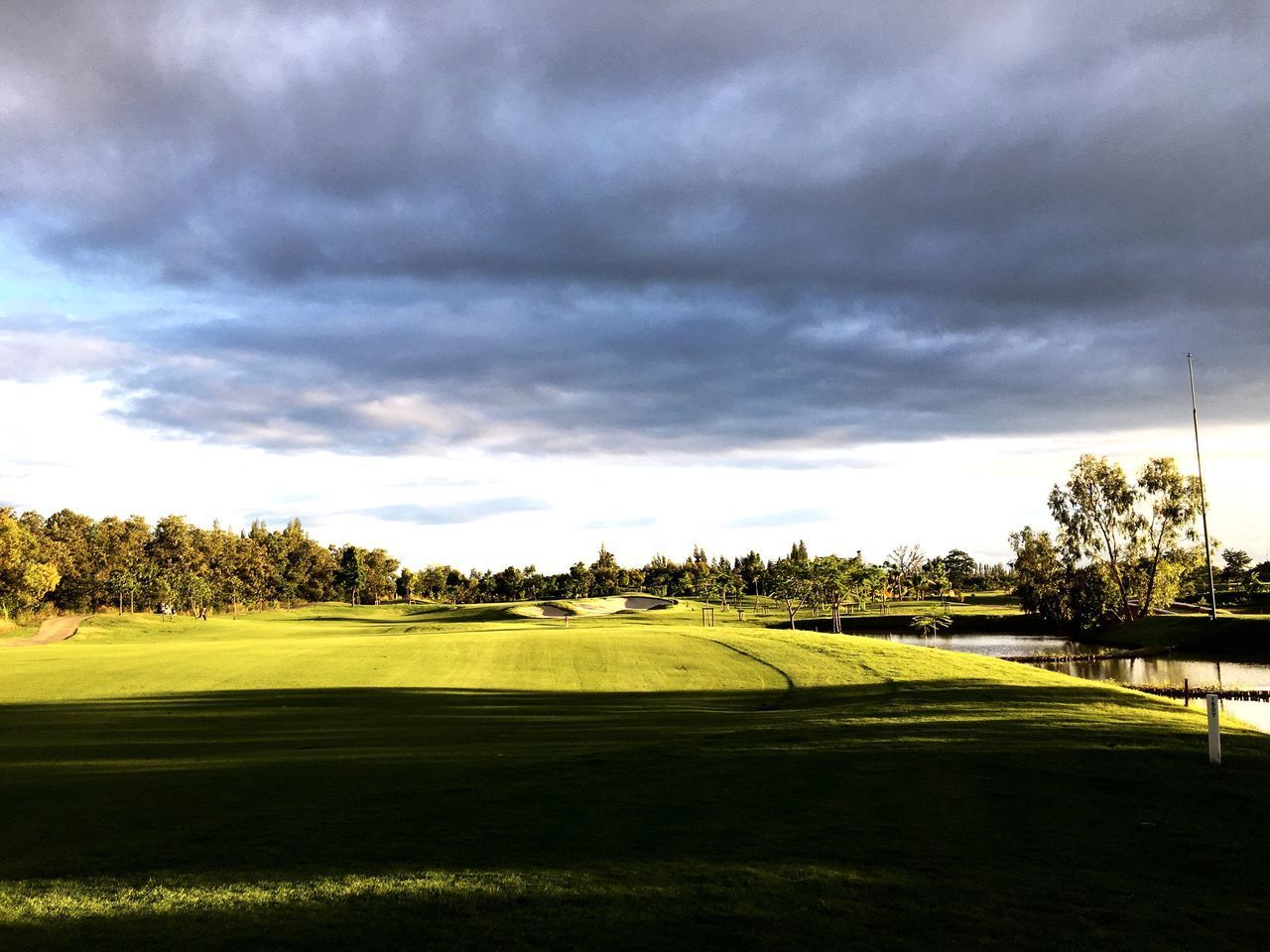 GOLF COURSE AGAINST SKY