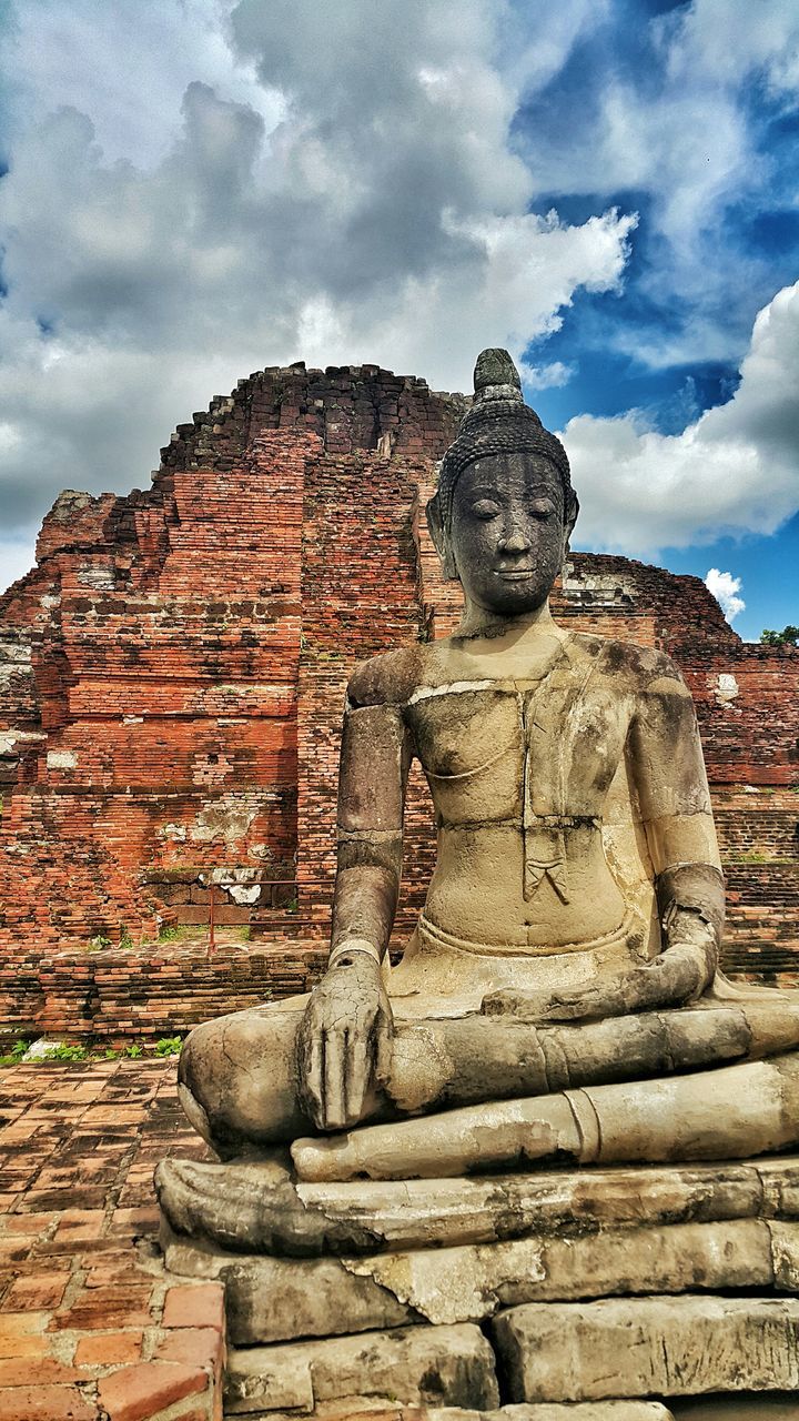 architecture, building exterior, built structure, history, sky, ancient, stone wall, cloud - sky, old, low angle view, the past, religion, old ruin, place of worship, famous place, ancient civilization, travel destinations, spirituality, stone material, cloud