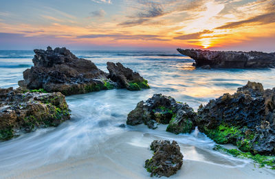 Scenic view of sea against sky during sunset