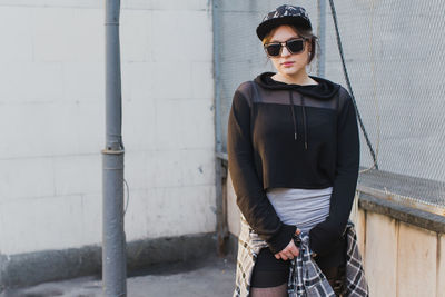 Portrait of young woman wearing sunglasses