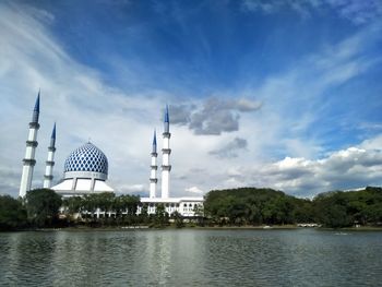 Tower amidst buildings against sky