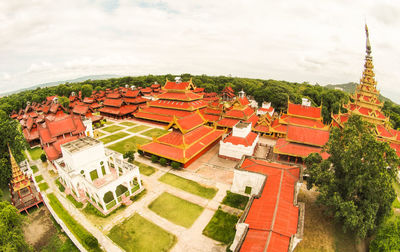 High angle view of buildings in city against sky