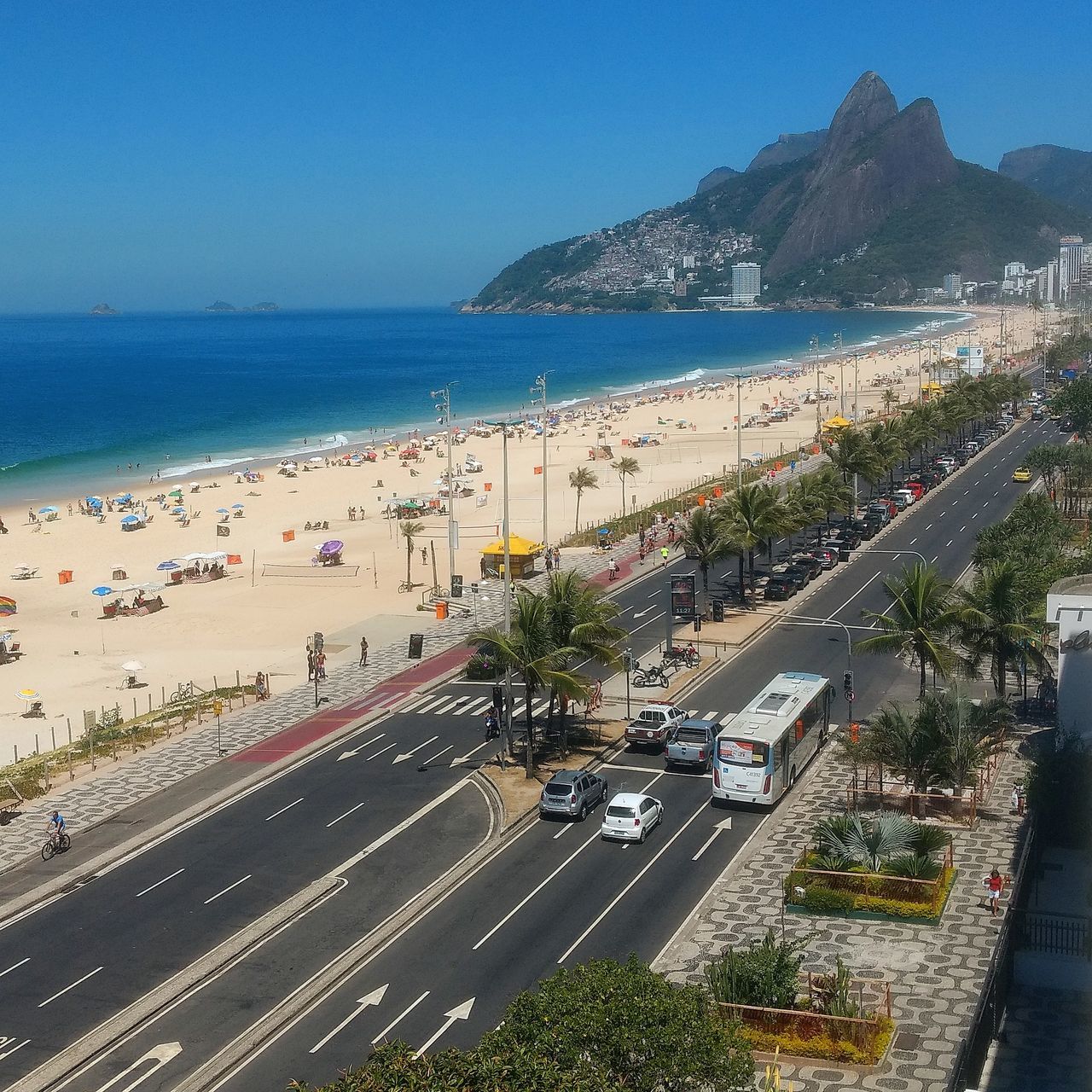 car, transportation, sea, road, land vehicle, mode of transport, high angle view, water, day, horizon over water, clear sky, outdoors, built structure, blue, nature, sky, architecture, city, no people, building exterior, mountain, tree