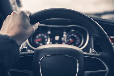 Close-up of man driving car