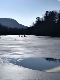 Scenic view of frozen lake against sky