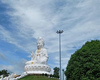 Low angle view of statue against sky