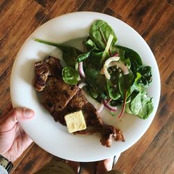 High angle view of hand holding food