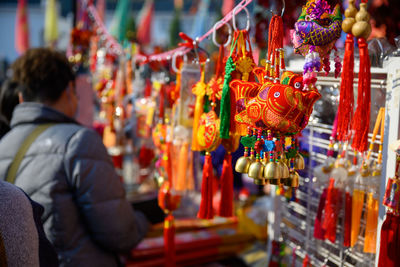 Man hanging at market stall