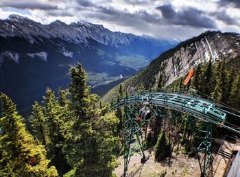 High angle view of trees and mountains against sky