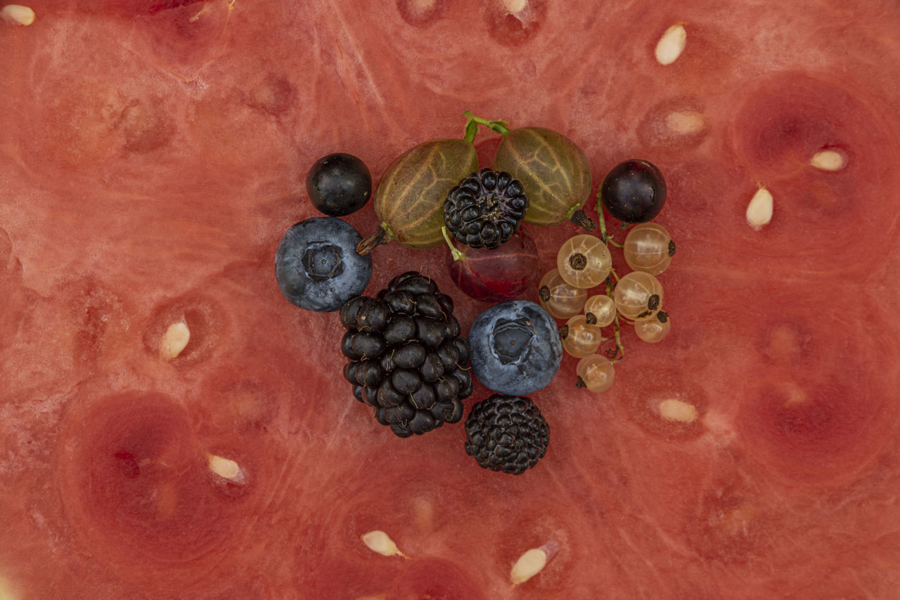 HIGH ANGLE VIEW OF BERRIES ON TEXTURED SURFACE