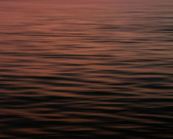 Full frame shot of sea against sky during sunset