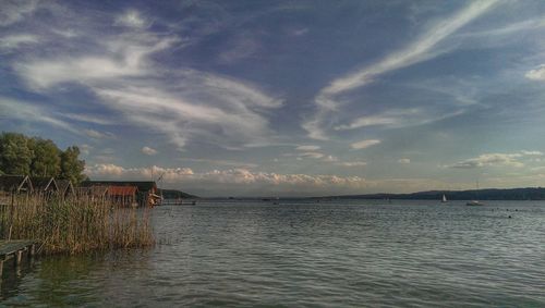 Scenic view of sea against cloudy sky