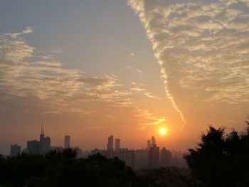 Cityscape against sky during sunset