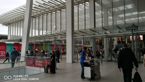 People waiting at railroad station platform