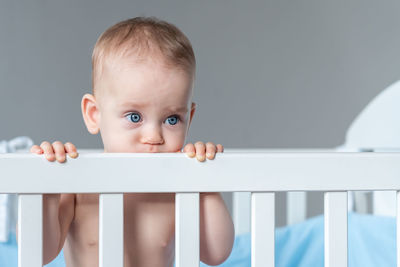 Portrait of cute baby boy looking away