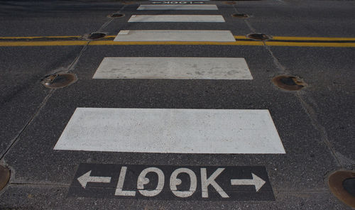 High angle view of text on zebra crossing