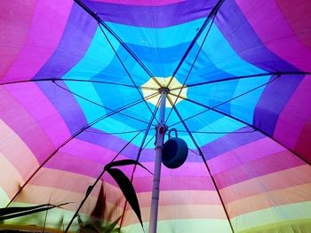 Low angle view of multi colored umbrellas hanging on ceiling