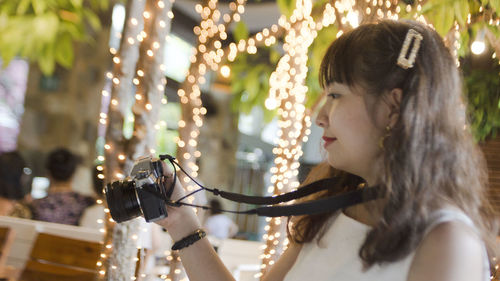 Portrait of young woman looking at camera