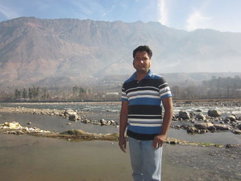 Portrait of man standing in lake