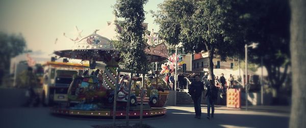 View of ferris wheel against cloudy sky