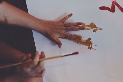 Close-up of hand holding paper