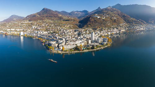 Aerial view of lake and buildings in city