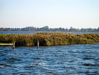 Scenic view of lake against clear sky